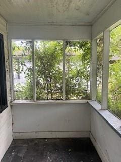 unfurnished sunroom featuring a healthy amount of sunlight