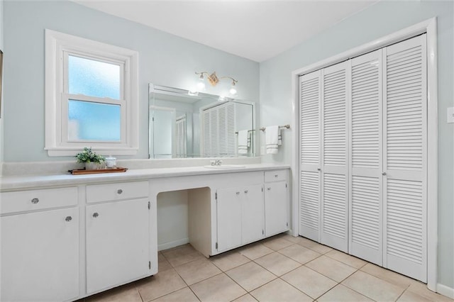 bathroom with tile patterned floors and vanity