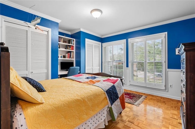 bedroom with crown molding and parquet flooring