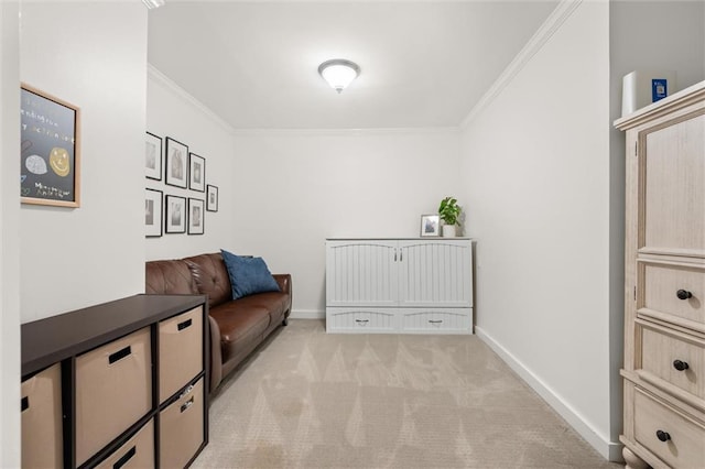 sitting room featuring light colored carpet and ornamental molding