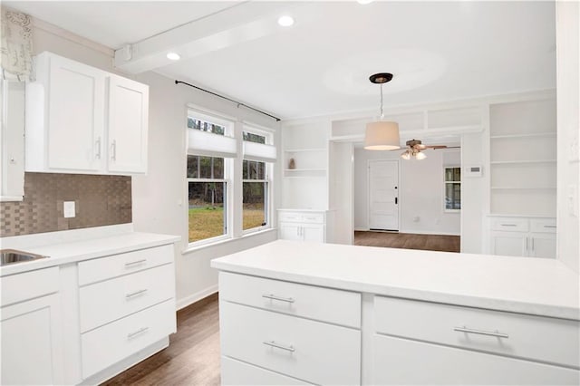 2014 Bakers Ln, Mobile, AL 36605 - kitchen featuring dark wood-style floors, open shelves, ceiling fan, light countertops, and white cabinetry