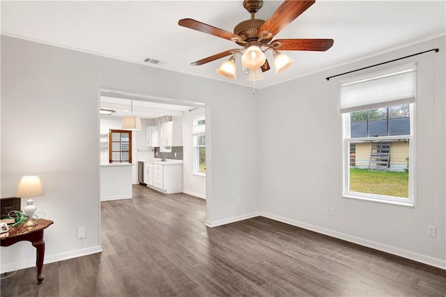 2014 Bakers Ln, Mobile, AL 36605 - spare room featuring ceiling fan, visible vents, a healthy amount of sunlight, and dark wood finished floors