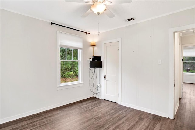 2014 Bakers Ln, Mobile, AL 36605 - empty room featuring wood finished floors, visible vents, a wealth of natural light, and ceiling fan