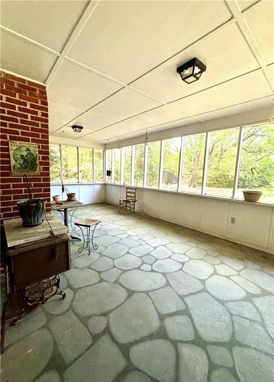 unfurnished sunroom featuring a healthy amount of sunlight