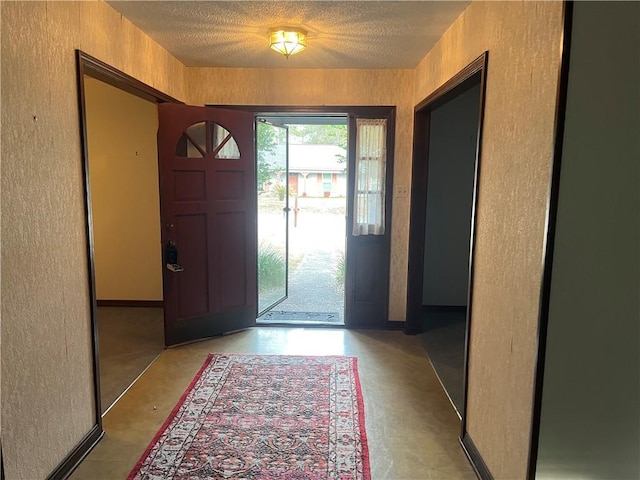 entrance foyer featuring a textured ceiling