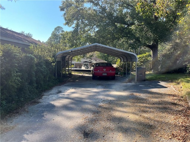 view of parking / parking lot with a carport