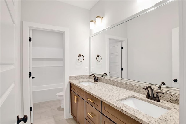 8760 Floyd Crabtree Way, Semmes, AL 36575 - bathroom featuring double vanity, a sink, toilet, and a tub to relax in