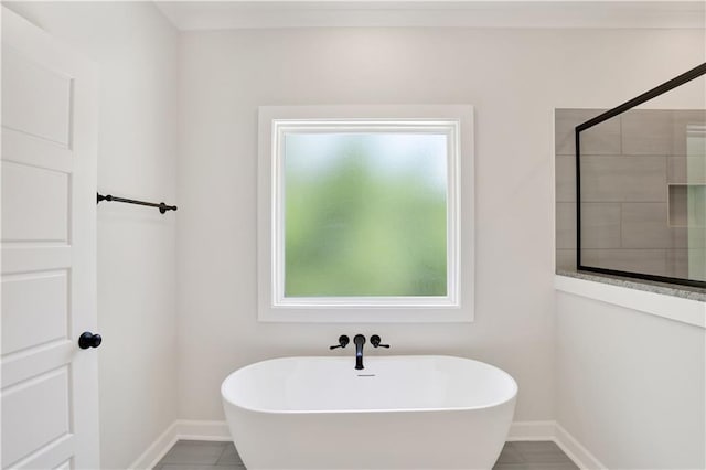 8760 Floyd Crabtree Way, Semmes, AL 36575 - full bath featuring baseboards, tile patterned flooring, tiled shower, and a soaking tub