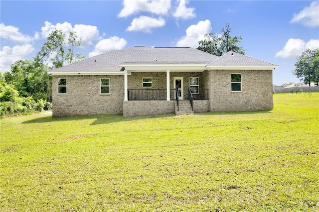 8760 Floyd Crabtree Way, Semmes, AL 36575 - rear view of house featuring a lawn, brick siding, and a porch