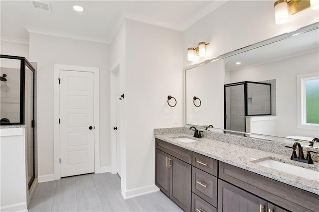 8760 Floyd Crabtree Way, Semmes, AL 36575 - bathroom featuring baseboards, a sink, and a shower stall