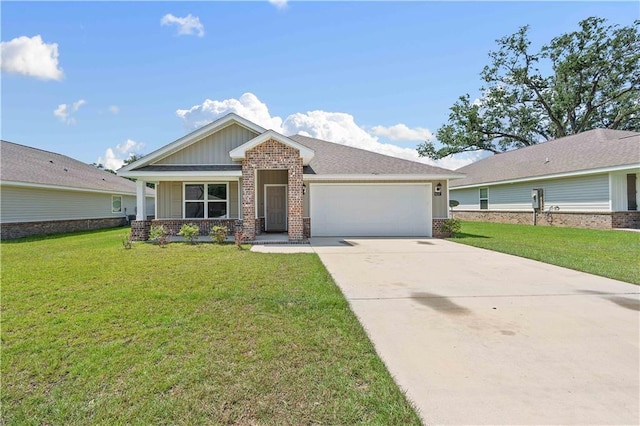 view of front of property featuring a front yard and a garage