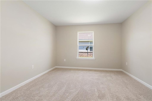 spare room featuring carpet floors