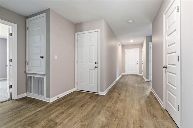 hall with dark hardwood / wood-style floors