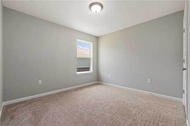 empty room featuring carpet flooring