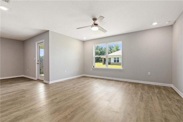 empty room featuring ceiling fan and wood-type flooring