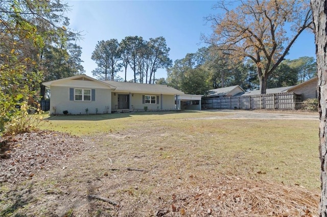 rear view of property featuring a yard