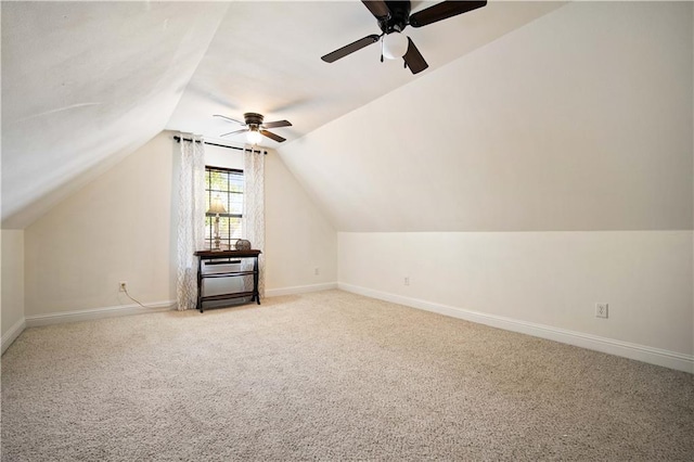 additional living space featuring ceiling fan, light carpet, and lofted ceiling