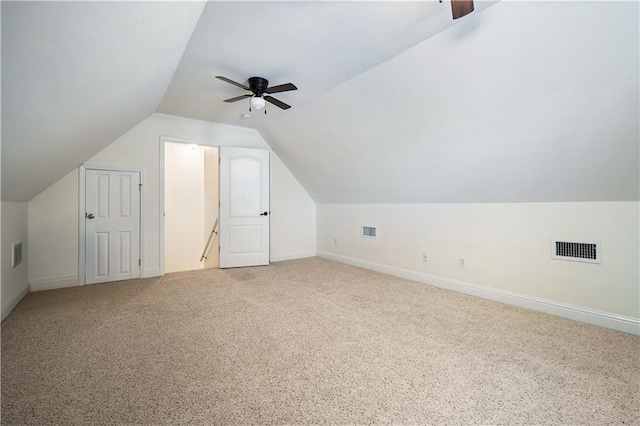 additional living space featuring ceiling fan, carpet floors, and vaulted ceiling