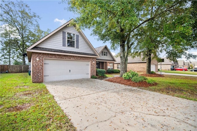 view of front of home with a front yard and a garage