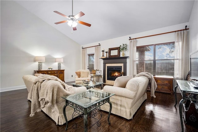 living room featuring ceiling fan, dark wood-type flooring, high vaulted ceiling, and a tiled fireplace