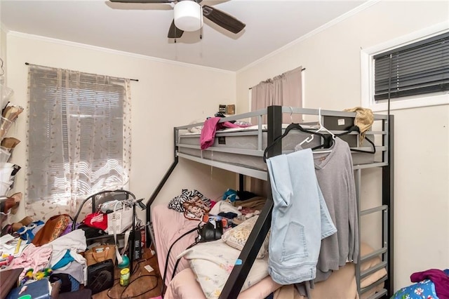bedroom with ceiling fan and ornamental molding