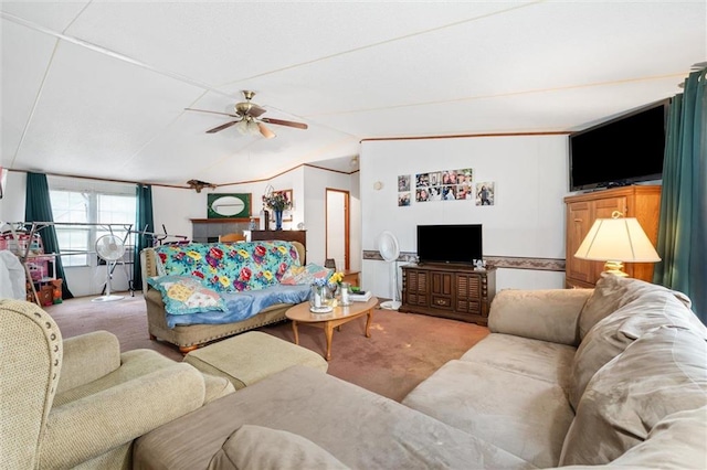 carpeted living room with vaulted ceiling and ceiling fan