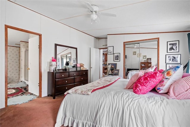 carpeted bedroom featuring ceiling fan and a closet