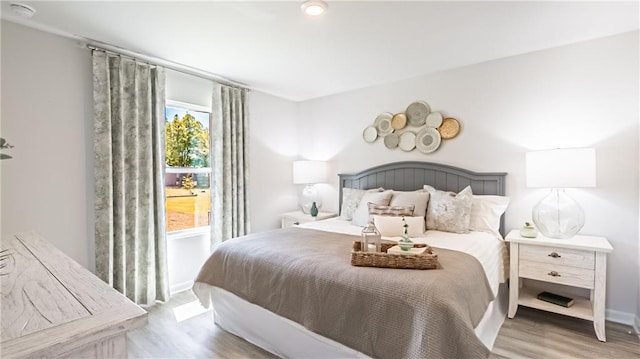 bedroom with light wood-type flooring