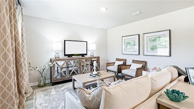 living room with light hardwood / wood-style floors