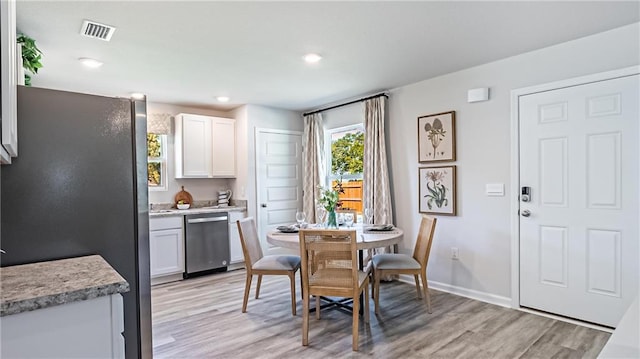 dining room featuring light hardwood / wood-style flooring