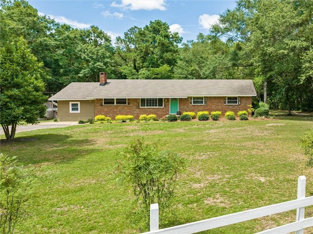 ranch-style home with a front lawn