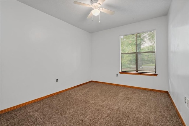 562 Vaughn Dr N, Satsuma, AL 36572 - carpeted spare room with baseboards and a ceiling fan