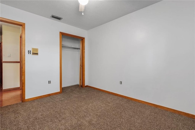 562 Vaughn Dr N, Satsuma, AL 36572 - unfurnished bedroom with carpet floors, a closet, baseboards, and ceiling fan
