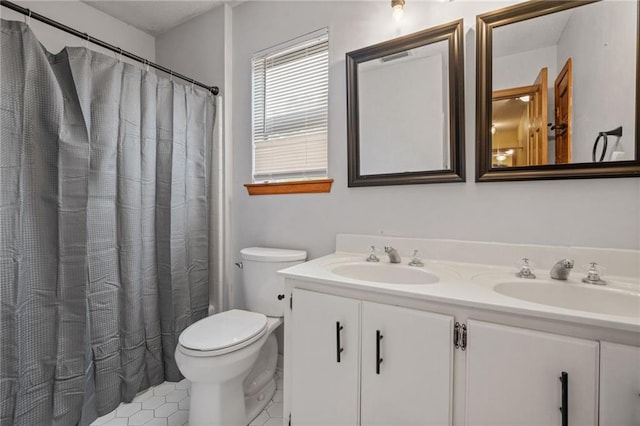 562 Vaughn Dr N, Satsuma, AL 36572 - bathroom with toilet, double vanity, tile patterned floors, and a shower with curtain