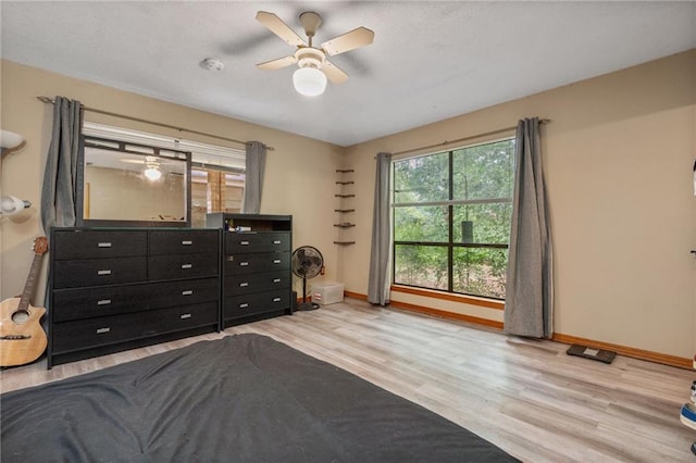 562 Vaughn Dr N, Satsuma, AL 36572 - bedroom with wood finished floors, baseboards, and ceiling fan