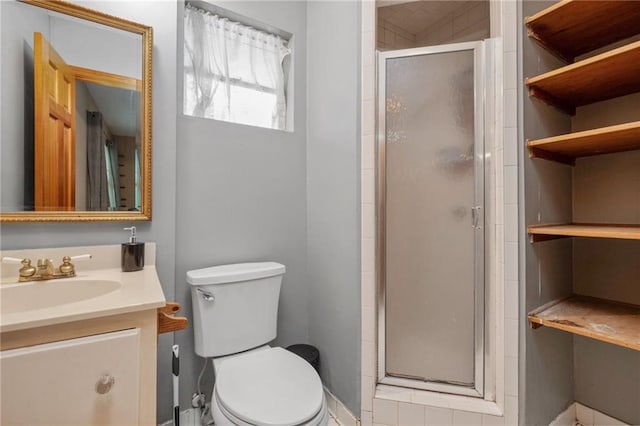 562 Vaughn Dr N, Satsuma, AL 36572 - full bathroom with a shower stall, vanity, and toilet