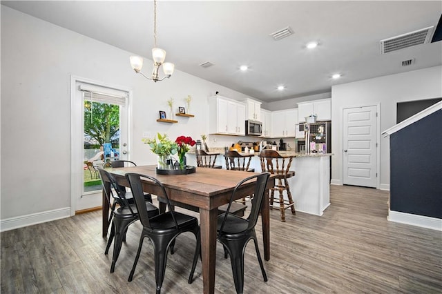24341 Alydar Loop, Daphne, AL 36526 - dining space with wood finished floors, a chandelier, baseboards, and recessed lighting