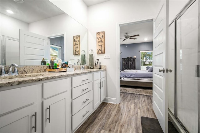 24341 Alydar Loop, Daphne, AL 36526 - ensuite bathroom with wood finished floors, a shower stall, double vanity, baseboards, and ceiling fan