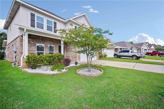 24341 Alydar Loop, Daphne, AL 36526 - view of front facade with brick siding, concrete driveway, board and batten siding, a front lawn, and an attached garage