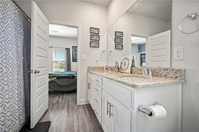 24341 Alydar Loop, Daphne, AL 36526 - bathroom featuring ensuite bath, wood finished floors, vanity, and baseboards