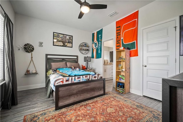 24341 Alydar Loop, Daphne, AL 36526 - bedroom featuring wood finished floors, baseboards, a ceiling fan, and ensuite bathroom