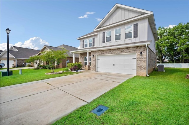 24341 Alydar Loop, Daphne, AL 36526 - view of front facade with board and batten siding, central air condition unit, a garage, driveway, and brick siding