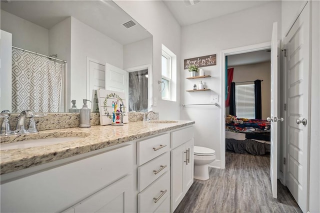 24341 Alydar Loop, Daphne, AL 36526 - full bath with wood finished floors, ensuite bathroom, double vanity, and toilet