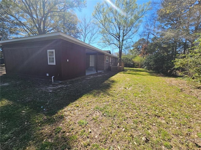 view of home's exterior featuring a yard