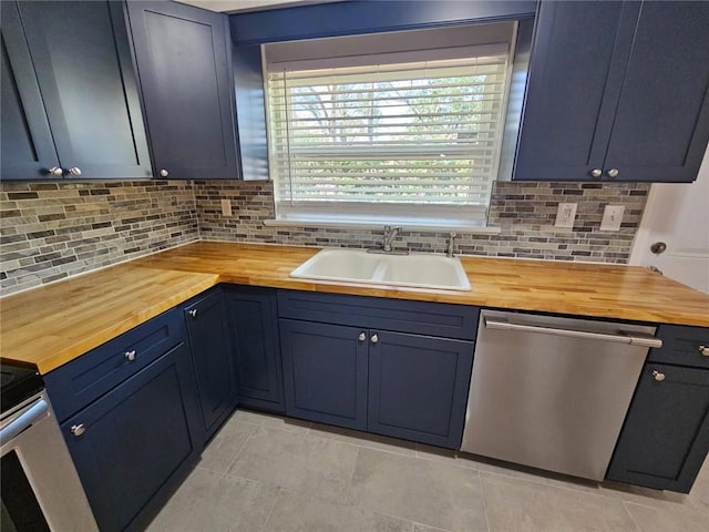 kitchen featuring wooden counters, a sink, tasteful backsplash, and dishwasher