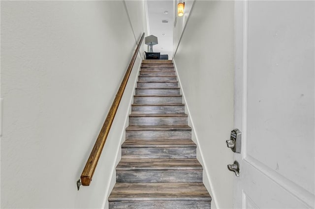 1385 Beach Blvd W, Gulf Shores, AL 36542 - staircase featuring dark hardwood / wood-style flooring