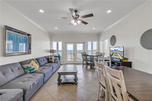 1385 Beach Blvd W, Gulf Shores, AL 36542 - tiled living room with ceiling fan, french doors, a water view, and ornamental molding