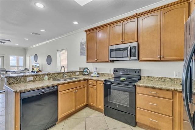 1385 Beach Blvd W, Gulf Shores, AL 36542 - kitchen with kitchen peninsula, crown molding, black appliances, sink, and light tile floors