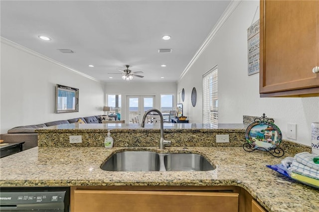 1385 Beach Blvd W, Gulf Shores, AL 36542 - kitchen featuring crown molding, dishwashing machine, light stone counters, sink, and ceiling fan