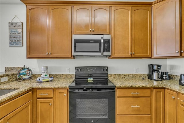 1385 Beach Blvd W, Gulf Shores, AL 36542 - kitchen featuring light stone countertops and black / electric stove